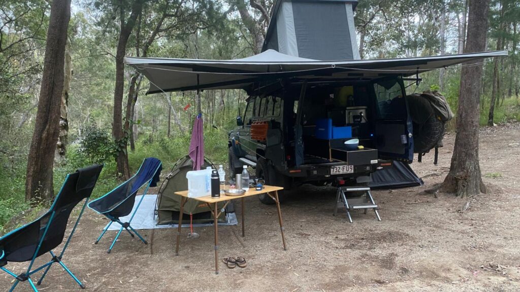 Destination4wd freestanding awning on blue Toyota troopy and grey canvas awning and a grey shower awning