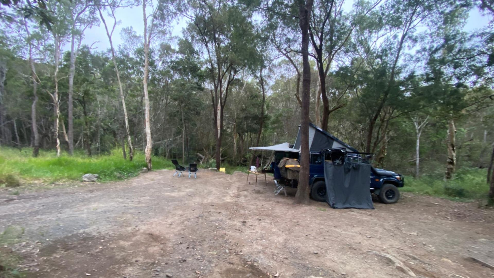 Destination4wd freestanding awning on blue Toyota troopy and grey canvas awning and a grey shower awning